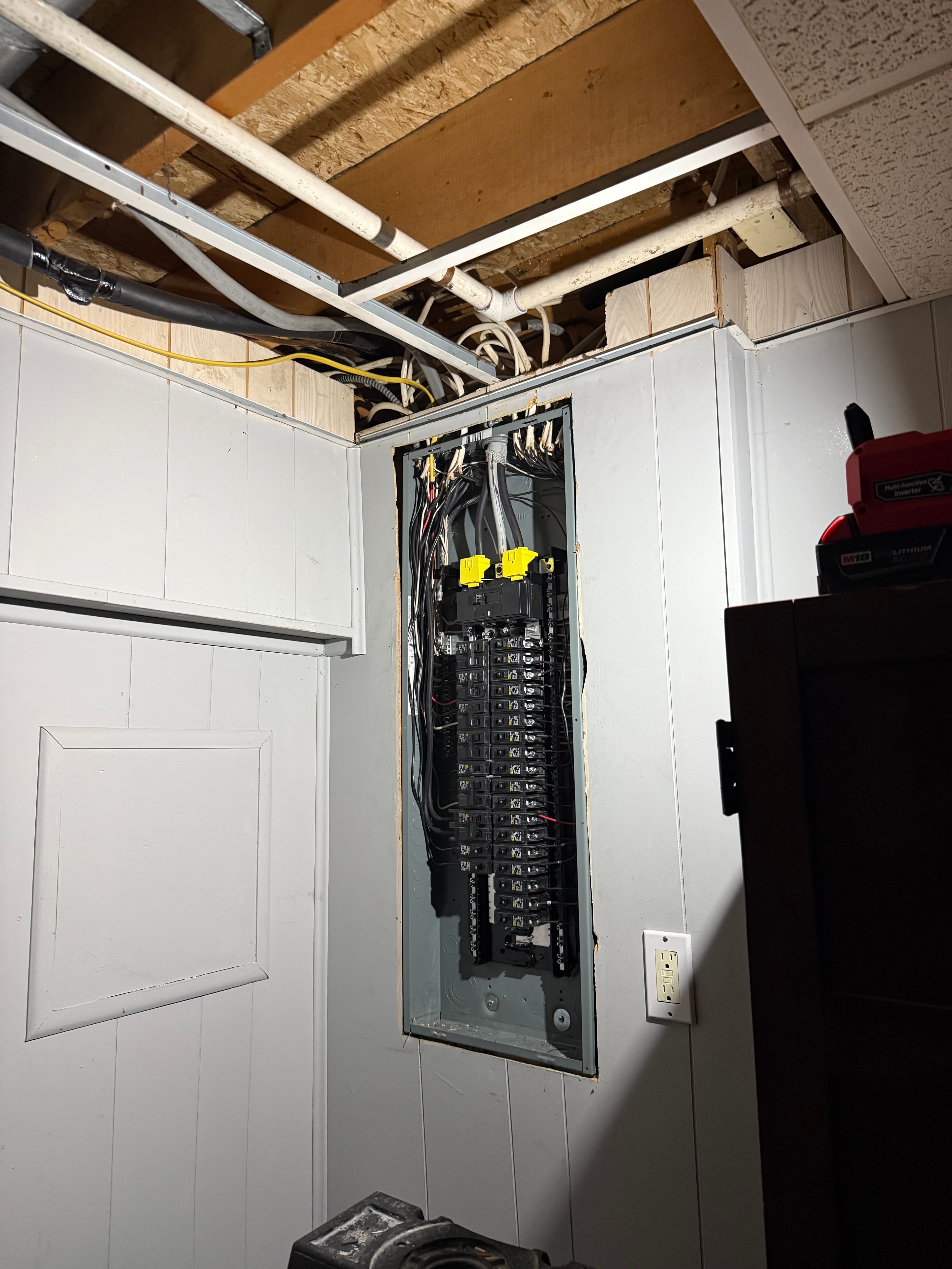Alarm system panel being installed on wall