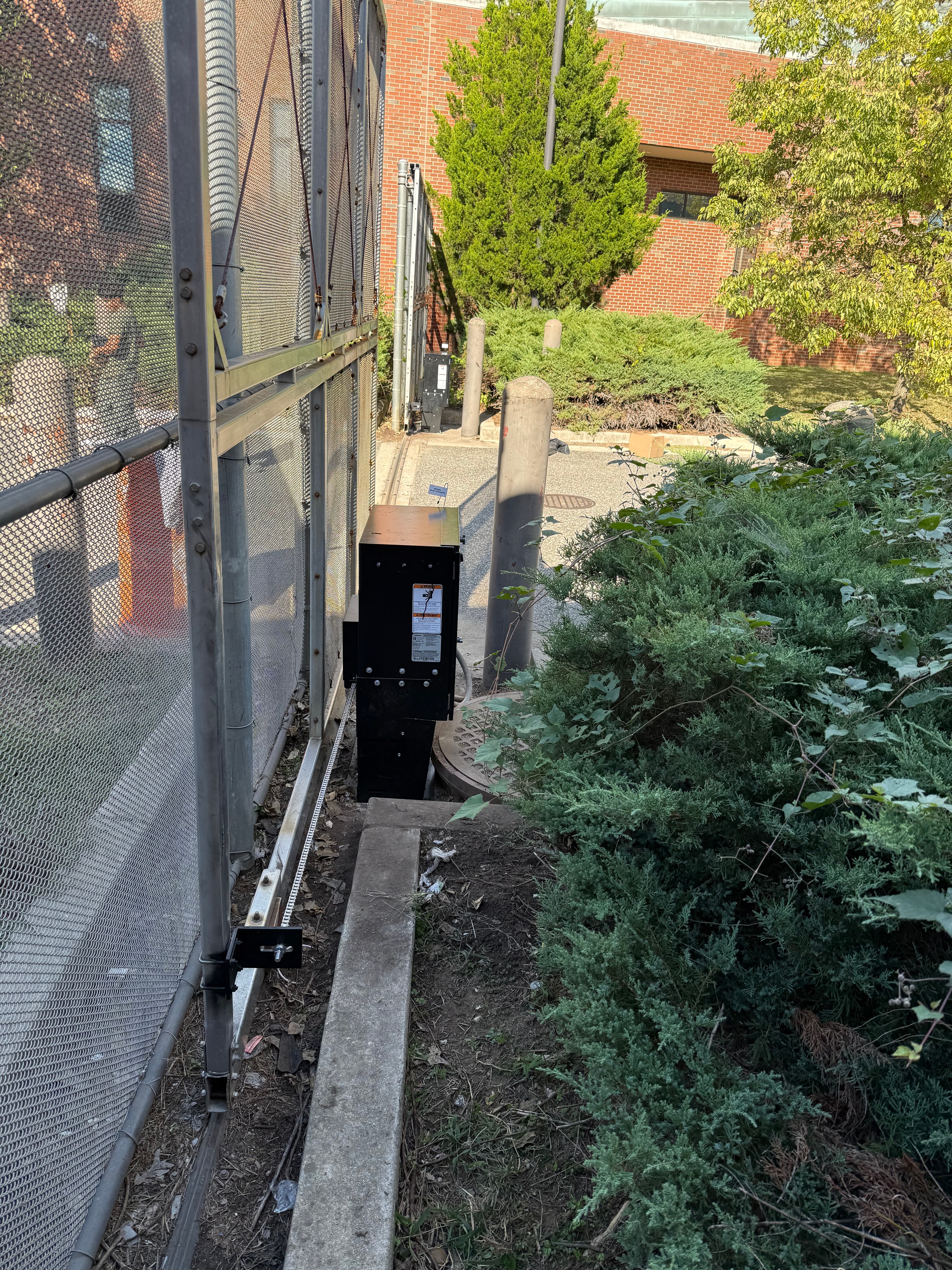 Security technician performing maintenance on equipment